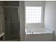 Bathroom with a separate tub and shower at 2015 Tennessee Road Rd, Durham, NC 27704