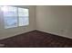 Bright bedroom with sunlight and dark carpet at 2015 Tennessee Road Rd, Durham, NC 27704