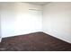 Bedroom featuring a closet with white folding doors and dark carpet at 2015 Tennessee Road Rd, Durham, NC 27704