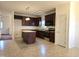 Spacious kitchen with an island, stainless steel appliances, and dark cabinets at 2015 Tennessee Road Rd, Durham, NC 27704