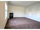 Open living room with dark carpet and fireplace at 2015 Tennessee Road Rd, Durham, NC 27704