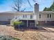 Backyard featuring a wood deck, gravel, and a view of the home at 204 Lopez Ln, Clayton, NC 27527