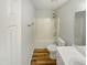 Bathroom with wood look flooring, shower and tub combination, toilet and vanity at 204 Lopez Ln, Clayton, NC 27527