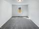 Bedroom featuring neutral walls and plush carpeting with a single window at 204 Lopez Ln, Clayton, NC 27527