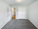 Bedroom with plush carpeting, double door closet and access to the bathroom at 204 Lopez Ln, Clayton, NC 27527