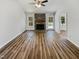 Spacious living area with stone fireplace, neutral walls, and hardwood floors at 204 Lopez Ln, Clayton, NC 27527