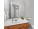 Bathroom with a single sink vanity, wood cabinetry and clean lines offering a peaceful and functional space at 205 Caniff Ln, Cary, NC 27519