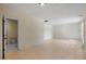 Spacious living room featuring neutral walls and light-colored floors, creating a bright and airy atmosphere at 205 Caniff Ln, Cary, NC 27519