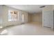 Open living room with light-colored floors and access to the outdoor deck through a glass door at 205 Caniff Ln, Cary, NC 27519