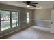 This carpeted bedroom has two nice windows providing ample natural light at 209 Reade Dr, Roxboro, NC 27573
