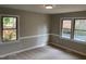 Cozy bedroom featuring fresh paint, carpet flooring and nice windows at 209 Reade Dr, Roxboro, NC 27573