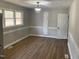 Bright dining room featuring hardwood floors, modern lighting, and fresh paint ready for the next meal at 209 Reade Dr, Roxboro, NC 27573