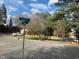 Street view of property at the corner of Reade Drive and Long Avenue with shade trees and green space at 209 Reade Dr, Roxboro, NC 27573
