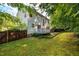 Exterior view of a home showcasing the deck and backyard space at 2310 Woodbury Dr, Hillsborough, NC 27278