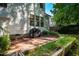 Spacious backyard with a brick patio and garden beds, ideal for outdoor living at 2310 Woodbury Dr, Hillsborough, NC 27278