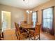 Dining room with natural light, wood table, and wood floors at 2310 Woodbury Dr, Hillsborough, NC 27278