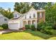 Well-maintained home with green lawn and attached two car garage at 2310 Woodbury Dr, Hillsborough, NC 27278