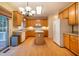 Open kitchen with wooden cabinets, stainless steel appliances, and a center island at 2310 Woodbury Dr, Hillsborough, NC 27278