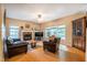Comfortable living room with a brick fireplace and multiple windows at 2310 Woodbury Dr, Hillsborough, NC 27278