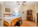 Main bedroom features a vaulted ceiling, a ceiling fan, and two windows at 2310 Woodbury Dr, Hillsborough, NC 27278
