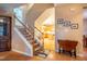 Staircase leading to the upper level, with a view of the kitchen and dining area at 2310 Woodbury Dr, Hillsborough, NC 27278