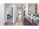 Bright foyer featuring hardwood floors, console table with décor, and open view into the bedroom at 2558 Summersby Dr, Mebane, NC 27302