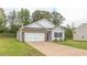 Inviting single-Gathering home boasts an attached garage, well-kept lawn, and welcoming curb appeal at 2558 Summersby Dr, Mebane, NC 27302