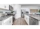 Well-equipped kitchen features stainless steel appliances, granite countertops, and ample cabinet space at 2558 Summersby Dr, Mebane, NC 27302