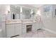 Bathroom vanity with double sinks, makeup table, and tile floors at 2617 Jones Ferry Rd, Chapel Hill, NC 27516