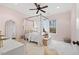 Elegant bedroom featuring a canopy bed with sheer curtains and a ceiling fan at 2617 Jones Ferry Rd, Chapel Hill, NC 27516