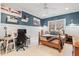 Cozy bedroom with desk, bed, and nautical-themed decor at 2617 Jones Ferry Rd, Chapel Hill, NC 27516