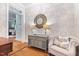 Foyer with hardwood floors, stylish wallpaper, accent table, and seating at 2617 Jones Ferry Rd, Chapel Hill, NC 27516