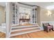 Open view to a game room featuring a pool table and built-in bookshelves at 2617 Jones Ferry Rd, Chapel Hill, NC 27516