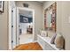 Hallway with hardwood floors and a glimpse into a bedroom at 2617 Jones Ferry Rd, Chapel Hill, NC 27516