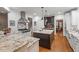 Gourmet kitchen with granite countertops, stainless steel appliances, and hardwood floors at 2617 Jones Ferry Rd, Chapel Hill, NC 27516