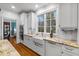 Gourmet kitchen features a large window, granite counters, white cabinets, and stainless steel appliances at 2617 Jones Ferry Rd, Chapel Hill, NC 27516