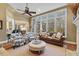 Spacious living room with large windows, neutral decor, and comfortable seating at 2617 Jones Ferry Rd, Chapel Hill, NC 27516