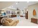 Expansive living room with warm neutral tones, recessed lighting, and access to the Primary bedroom at 2617 Jones Ferry Rd, Chapel Hill, NC 27516