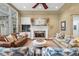 Elegant living room featuring a stone fireplace, comfortable sofas, and stylish decor at 2617 Jones Ferry Rd, Chapel Hill, NC 27516
