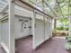 Enclosed outdoor shower with white siding and a wooden deck, providing privacy and nature at 2617 Jones Ferry Rd, Chapel Hill, NC 27516