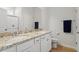 Well-lit bathroom featuring double sinks, granite countertops, and modern fixtures for a luxurious feel at 290 Forest Meadow Ln, Franklinton, NC 27525