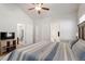 Bright bedroom showing a made bed, neutral walls, and easy access to bathroom at 290 Forest Meadow Ln, Franklinton, NC 27525