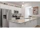 Bright kitchen with granite countertops, stainless steel appliances, and white cabinets at 290 Forest Meadow Ln, Franklinton, NC 27525