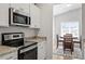 Close up on granite countertops, stainless steel appliances and white cabinets at 290 Forest Meadow Ln, Franklinton, NC 27525