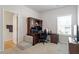 Home office offering a functional desk setup, comfortable seating, and abundant natural light from a large window at 290 Forest Meadow Ln, Franklinton, NC 27525