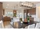 Dining area with modern lighting, next to the kitchen, perfect for meals at 320 Catheys Crk Cir, Wendell, NC 27591
