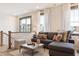 Comfortable living room with plush seating, stylish decor, and view of the neighborhood at 320 Catheys Crk Cir, Wendell, NC 27591