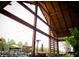 Open-air seating with stylish tables, chairs, umbrellas, and view of the surrounding landscape at 320 Catheys Crk Cir, Wendell, NC 27591