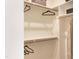 Spacious walk-in closet with built-in shelving and wooden rods for ample storage and organization at 320 Catheys Crk Cir, Wendell, NC 27591