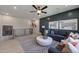 Bright living room includes a gray sectional, decor, and wood-look floors at 3218 Bruce Garner Rd, Creedmoor, NC 27522